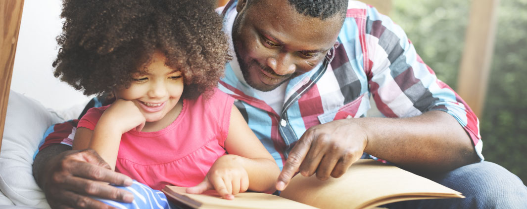 A father reading with his child