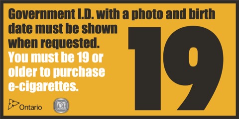 Sign indicating government ID with a photo and birth date must be shown when requested, and that you must be 19 years of age or older to purchase e-cigarettes products.