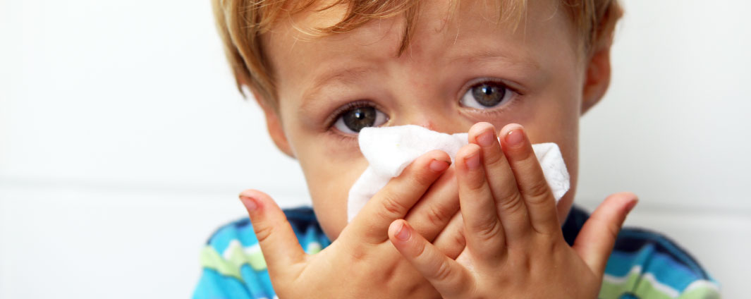 Child blowing nose